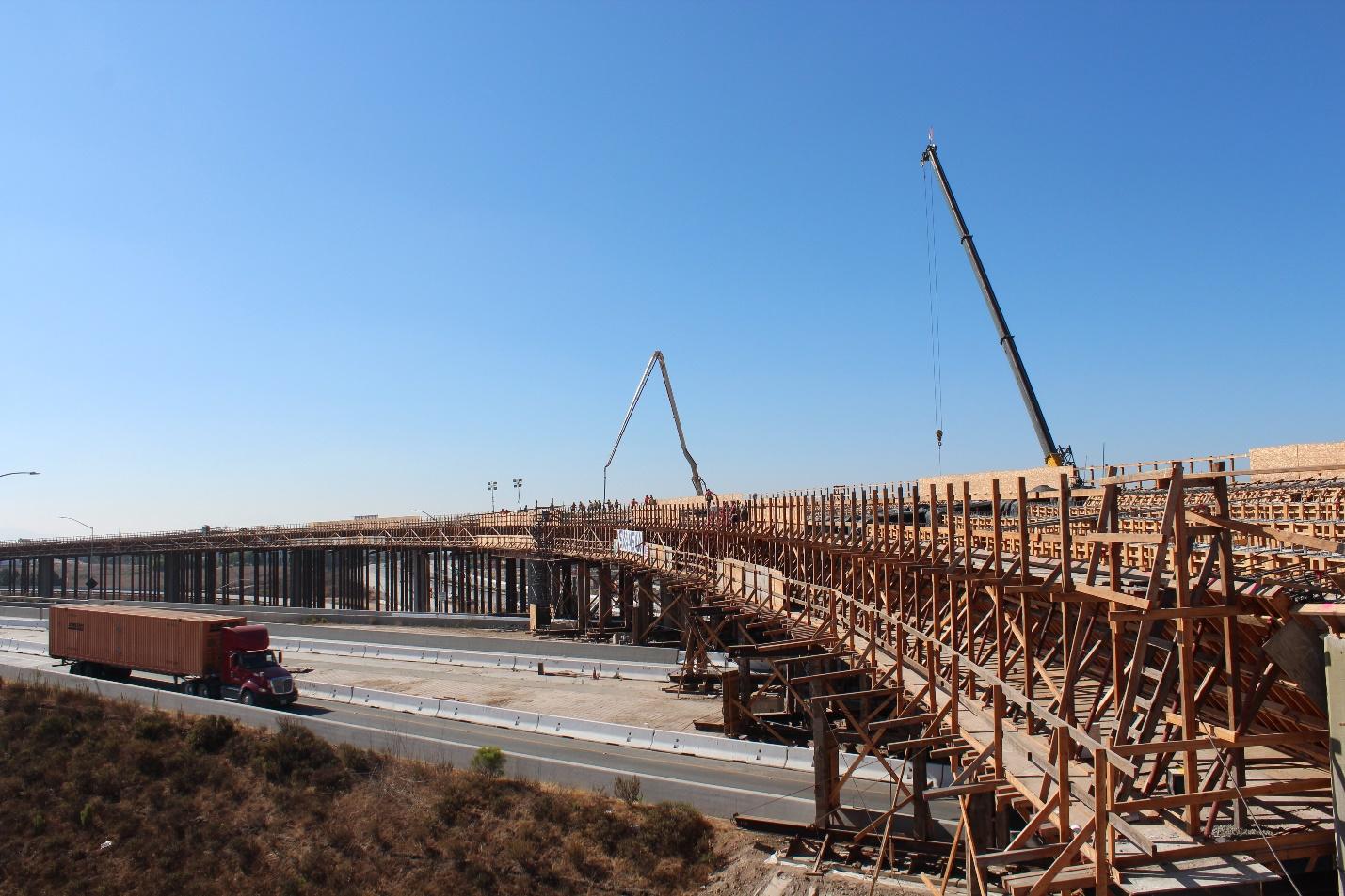 A side profile view of falsework, temporary wooden bridge support structures, for the future SR 125 to eastbound SR 11 connector.